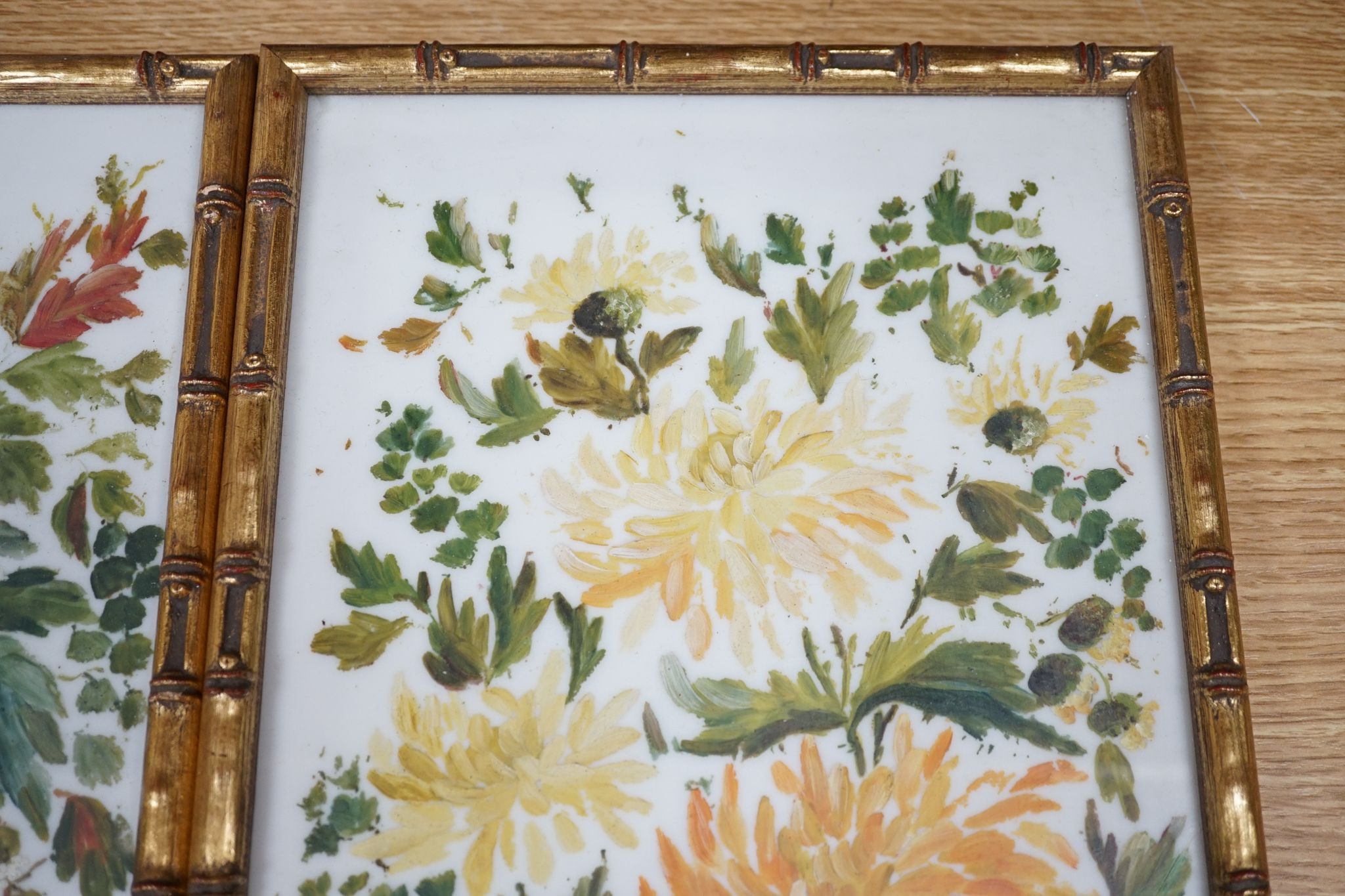 A pair of framed floral painted porcelain plaques signed F. Perrin, 41x19cm excl frames